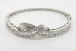 Diamond Bangle, the top half is a wrap over of round brilliant and baguette cut diamonds