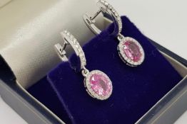 Pair Of Oval Pink Sapphire & Diamond Drop Earrings, on horseshoe tops, approximate total pink