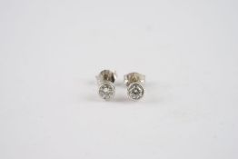 18CT WHITE GOLD DIAMOND STUD EARRINGS, 18ct white gold studs set with 0.3pt diamonds each.*** Please