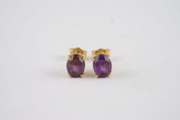 18CT GOLD AMETHYST SET STUD EARRINGS, a pair of 18ct gold studs set with est. 1ct amethyst