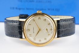 GENTLEMENS GARRARD 9CT GOLD PRESENTATION WATCH W/ BOX CIRCA 1960, circular patina dial with