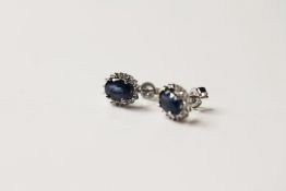 Pair of Sapphire & Diamond Earrings, set with 2 oval cut natural sapphires totalling 2.13ct,