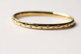 Diamond Set Bangle, 16 round brilliant cut diamonds flush set,18ct yellow gold, push clasp