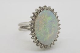 Oval Shaped Opal & Diamond Ring, with a double shank, diamonds