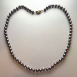 Freshwater Black Pearl Strand Necklace, 9ct yellow gold round clasp, approximate length 19.5 inches