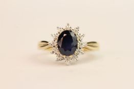9ct yellow gold sapphire and diamond cluster ring. Sapphire 1.72ct. Diamonds 0.06ct, ring size N.
