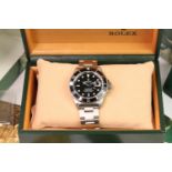 ROLEX SUBMARINER REFERENCE 16610 WITH BOX AND PAPERS 1994, circular black dial with applied baton