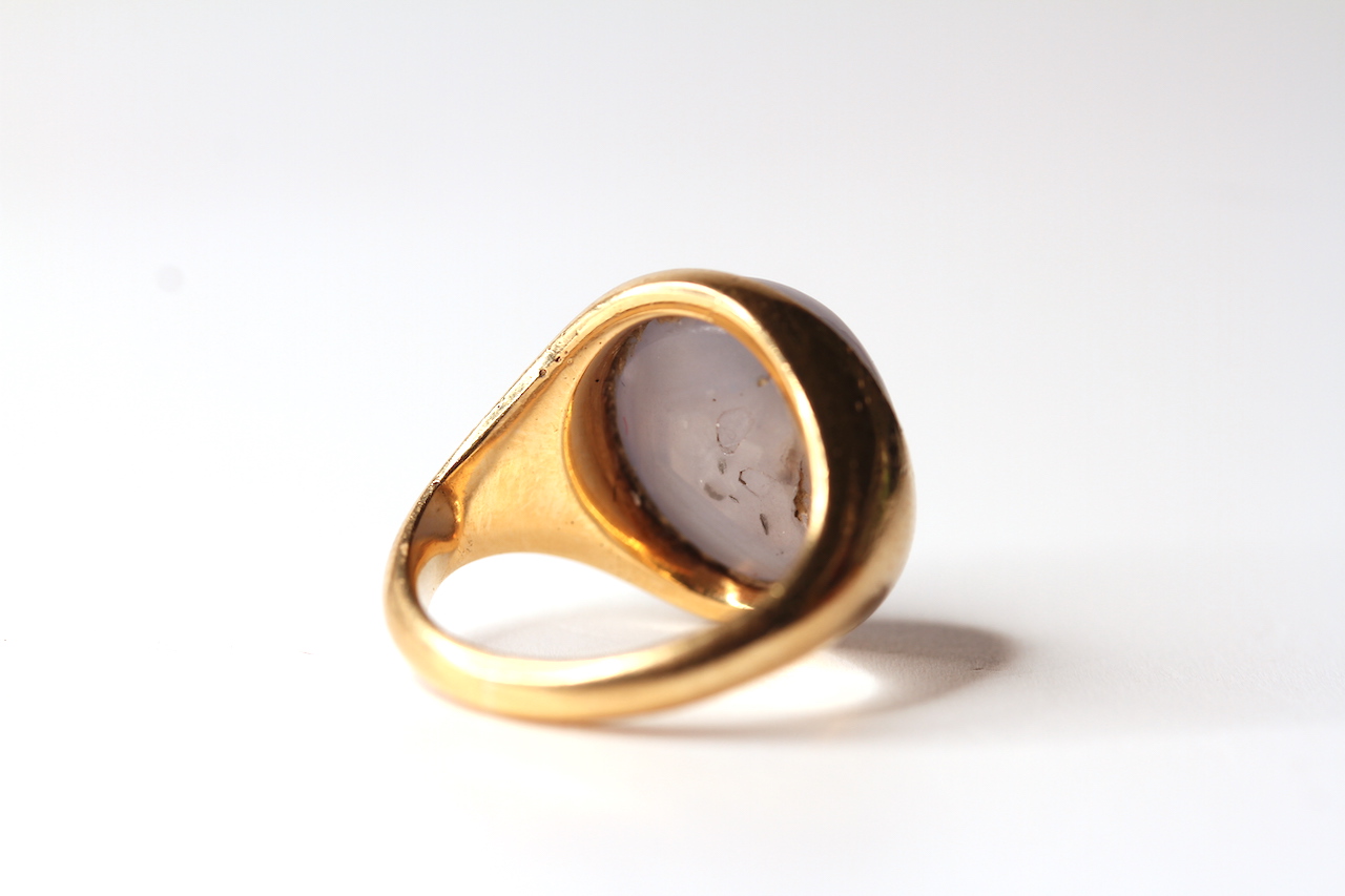 18CT CABOCHON STAR SAPPHIRE SIGNET RING. sapphire estimated 13x13 mm, not hallmarked, ring size K, - Image 2 of 2