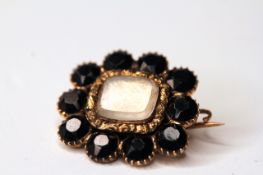 MOURNING BROOCH SET WITH JET CIRCA 1830, 9ct not hallmarked, with memory inscription on back,