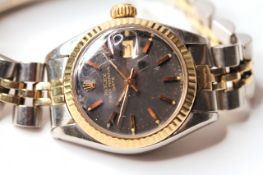 LADIES TWO TONE ROLEX DATE WRISWATCH, circular black dial with gold hands and gold hour markers,