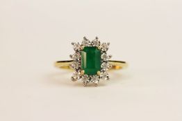 9ct yellow gold step-cut emerald and diamond cluster ring. Emerald 0.91ct. Diamonds 0.06ct, ring