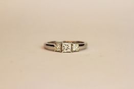 18ct white gold princess-cut diamond trilogy ring. Diamonds 0.75ct, ring size N 1/2.