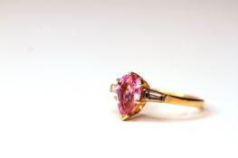 Pink sapphire & diamond set ring, pear shaped pink sapphire set to the centre measuring