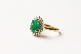 Emerald & Diamond Cluster Ring, set with an oval cut natural emerald 2.31ct, surrounded by 18