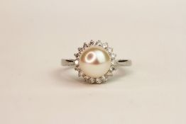 9ct white gold pearl and diamond halo ring. Diamonds 0.37ct, ring size N1/2.
