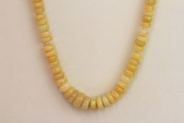 A string of faceted opal beads with a silver magnetic clasp. In excess of 100.00ct