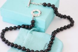 TIFFANY & CO 925 STERLING SILVER BLACK ONYX BEAD NECKLACE, an onyx bead toggle necklace produced