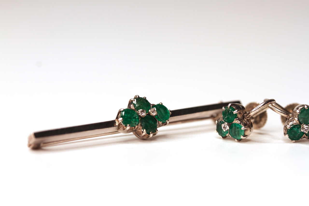 Pair of emerald and diamond earrings with matching brooch, total of 2 diamonds set to the centre