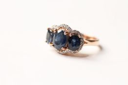 Sapphire & Diamond Trilogy Ring, set with 3 oval cut natural sapphires totalling 3.76ct,