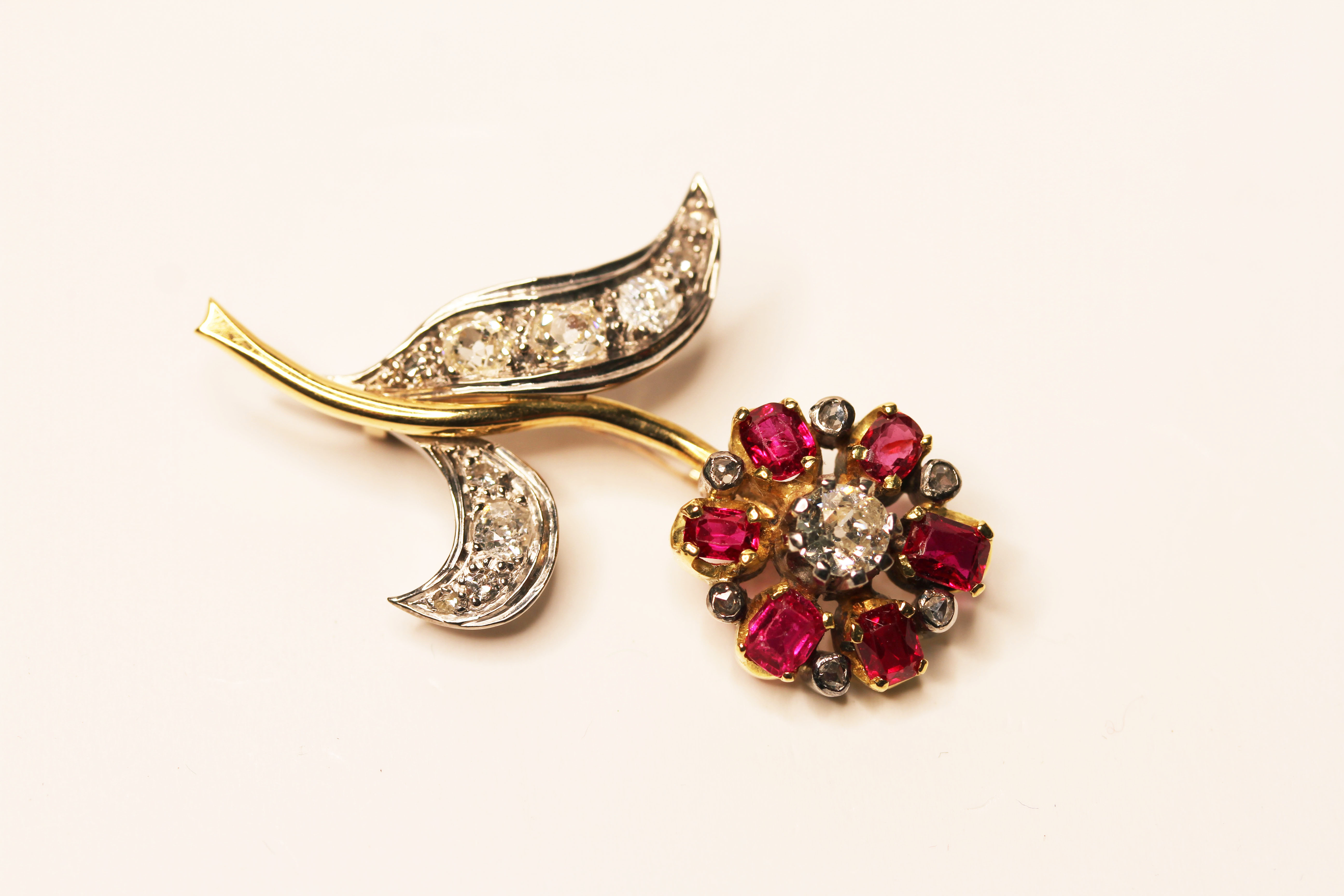 EDWARDIAN RUBY AND DIAMOND TWO TONE FLOWER BROOCH, 18ct gold, approximate size 43mm x 28mm.