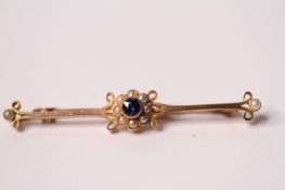 15ct Edwardian Sapphire and Pearl bar brooch, central blue sapphire within a cluster of pearls,