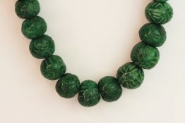Weighty earth-mined carved natural emerald bead necklace with woven, adjustable slip knot and