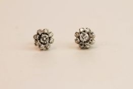 Pair Of Diamond Flower Stud Earrings, estimated total diamond weight 1.00ct, 18ct white gold,