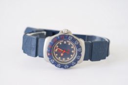 LADIES TAG HEUER PROFESSIONAL DATE WRISTWATCH, circular blue dial with hour markers and hands,