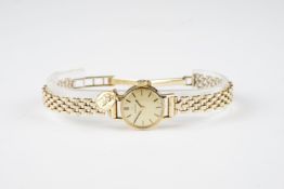 LADIES OMEGA 9CT GOLD COCKTAIL WATCH W/ PENDANT, circular champagne dial with stick hour markers and