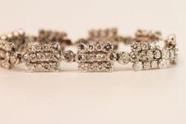 French Marked Art Deco Diamond Bracelet, 9 panels interlinked with a single diamond separating each,