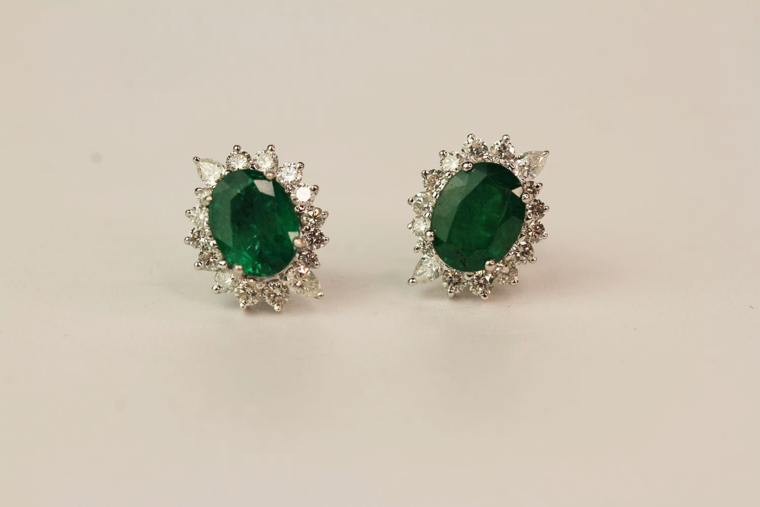 Pair Of Emerald & Diamond Earrings, set with round brilliant diamonds