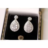 Pair Of Diamond Set Pear Shaped Drop Earrings, on a bezel set diamond stud with post and butterfly