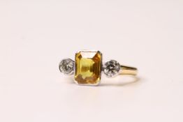 Yellow Sapphire & Diamond 3 Stone Ring, set in a white gold rub over setting on a yellow gold shank,