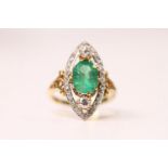 Emerald & Diamond Marquise Shaped Ring, set with a central oval emerald inside a diamond open