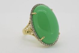 Cabochon Chalcedony Ring, 4 claw set, surrounded by a halo of micro set diamonds, 14ct yellow