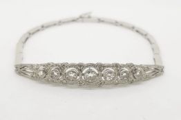 Diamond Set Art Deco Bracelet, with a central pave set panel, this has graduated bezel set diamonds,