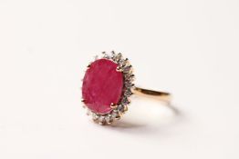 Ruby & Diamond Cluster Ring, set with an oval cut natural ruby 3.36ct, surrounded by 22 round