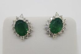 Pair Of Emerald & Diamond Earrings, set with round brilliant diamonds totalling approximately 1.00ct