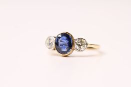 Sapphire & Diamond 3 Stone Ring, central oval sapphire bezel set in yellow gold, two outer