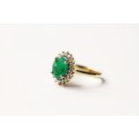 Emerald & Diamond Cluster Ring, set with an oval cut natural emerald 2.31ct, surrounded by 18