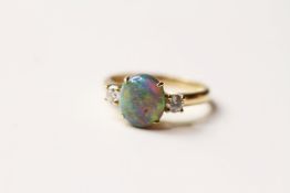 Opal & Diamond Ring, set with 1 cabochon cut natural opal 1.56ct, 2 round brilliant cut diamonds set