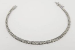 Diamond Line Bracelet, set with 70 brilliant cut diamonds, claw set, push button opening tongue