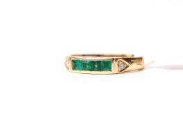 18ct Emerald and Diamond Ring, four square cut emeralds chanel set, a diamond to each shoulder, in