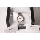 UNWORN TISSOT CHRONOGRAPH AUTOMATIC WITH BOX AND PAPERS, circular white dial with baton hour