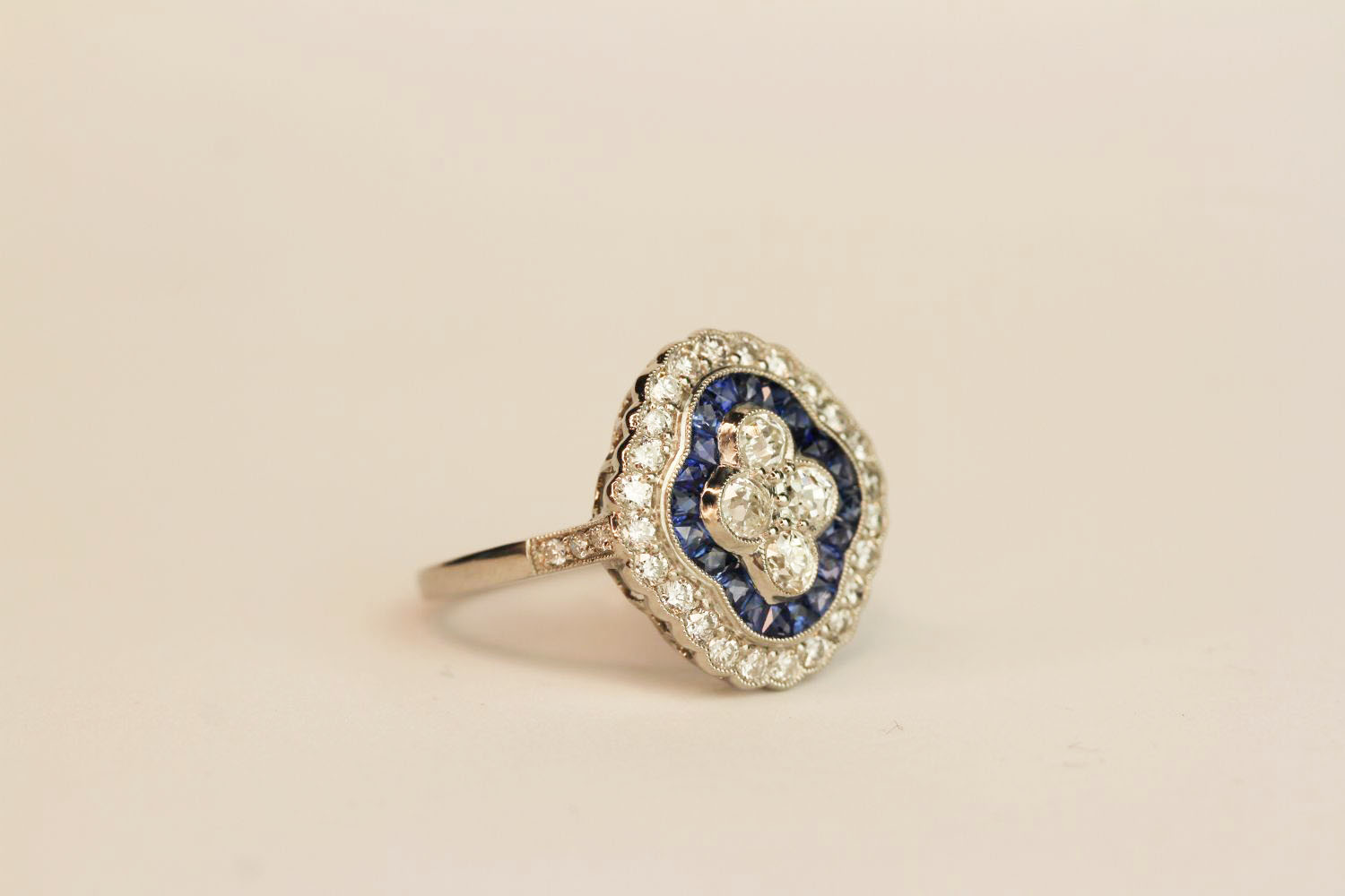 Platinum sapphire and diamond ring. Set with 4 central diamonds, surrounded by an inner halo of - Image 2 of 3