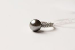 Tahitian Pearl & Diamond Ring, set with a cultured tahitian pearl, 56 round brilliant cut diamonds