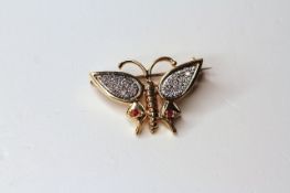 18CT DIAMOND AND RUBY BUTTERFLY BROOCH, dimensions 30x18mm, total weight 8.03gms.