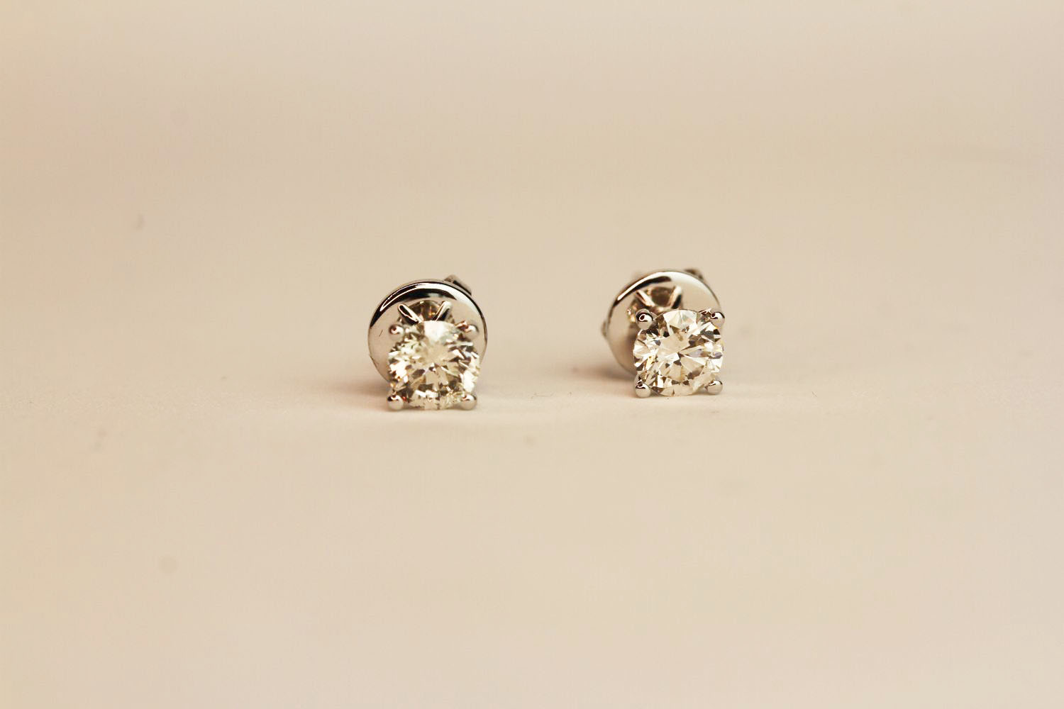 Pair 18ct white gold four claw diamond solitaire studs. 1.02ct total. Boxed, butterfly backs.