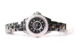 CHANEL J12 WRISTWATCH W/BOX & PAPERS, circular black dial with arabic numbers 3,6,9 and 12,