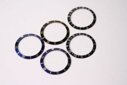 5x ROLEX BEZEL INSERTS, INCLUDING GMT AND BI-COLOUR SUBMARINERS, group of 5 Rolex bezel inserts,